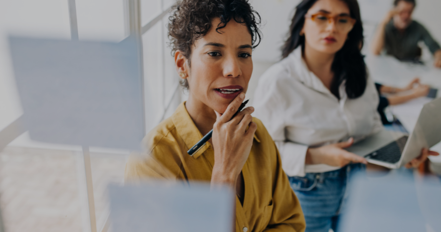 Business professional strategizing digital marketing trends during team meeting