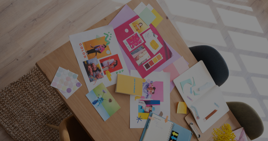 Brand identity design materials including color palettes, mood boards, and branding elements on designer workspace